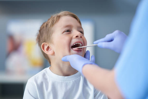 Picture of adorable little boy having doctor's appointment